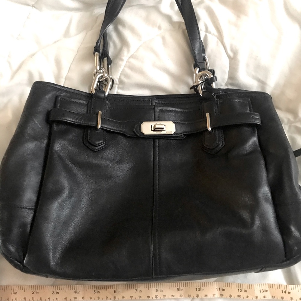Black medium sized coach shoulder bag.
